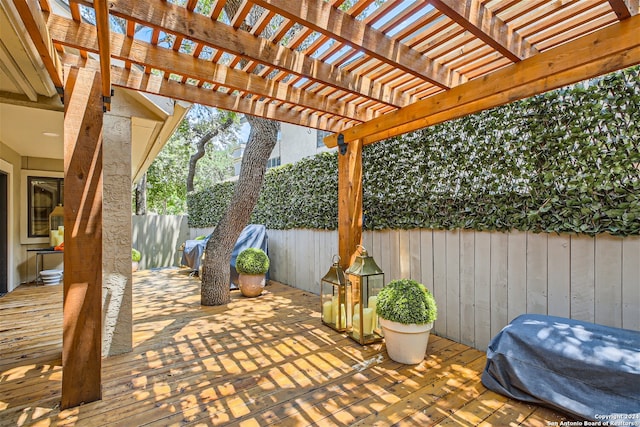 view of patio featuring a pergola and a wooden deck