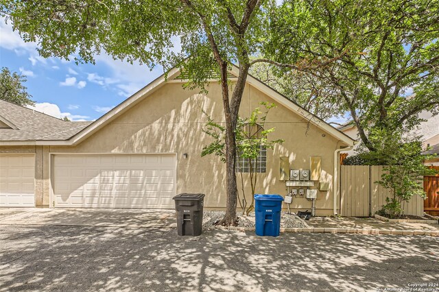 view of side of property with a garage