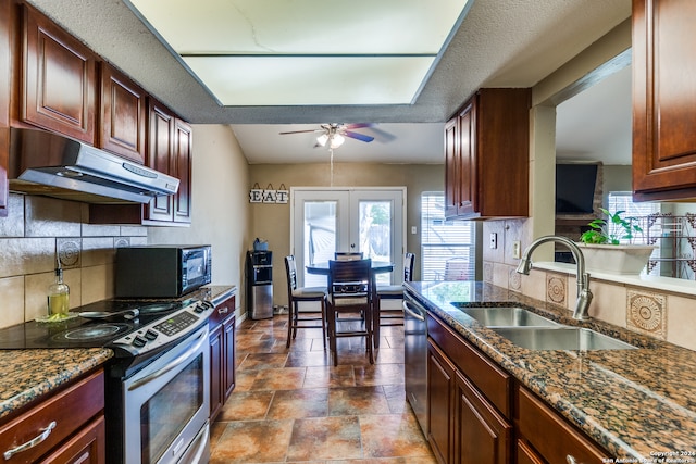 kitchen featuring french doors, sink, decorative backsplash, ceiling fan, and stainless steel appliances