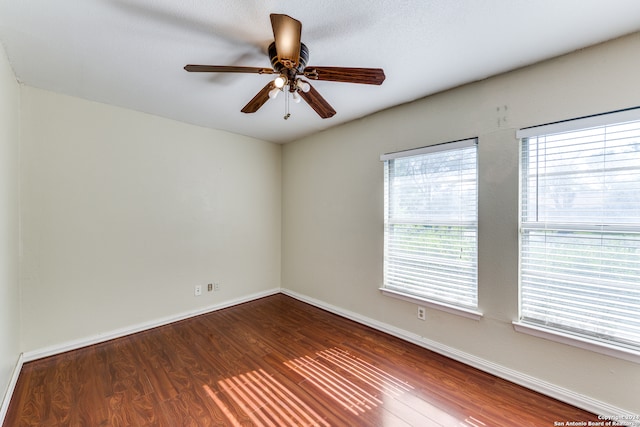 spare room with a textured ceiling, hardwood / wood-style flooring, and ceiling fan