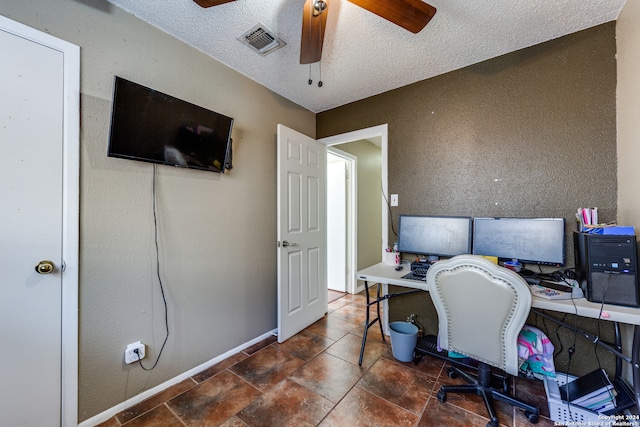 office space with ceiling fan and a textured ceiling