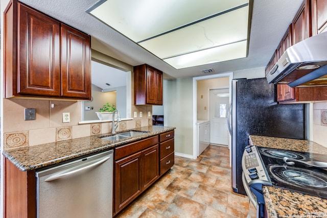 kitchen featuring dishwasher, sink, black electric range oven, dark stone countertops, and extractor fan