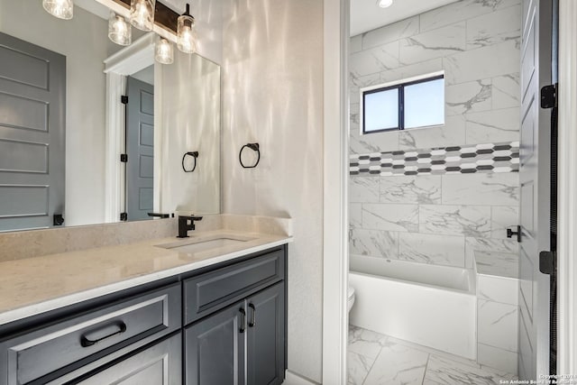 full bathroom with vanity, toilet, and tiled shower / bath combo