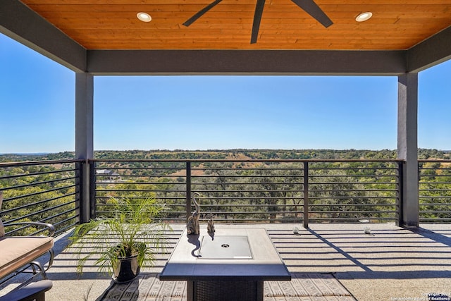 view of patio / terrace featuring a balcony and ceiling fan