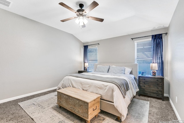 bedroom with carpet, ceiling fan, lofted ceiling, and multiple windows