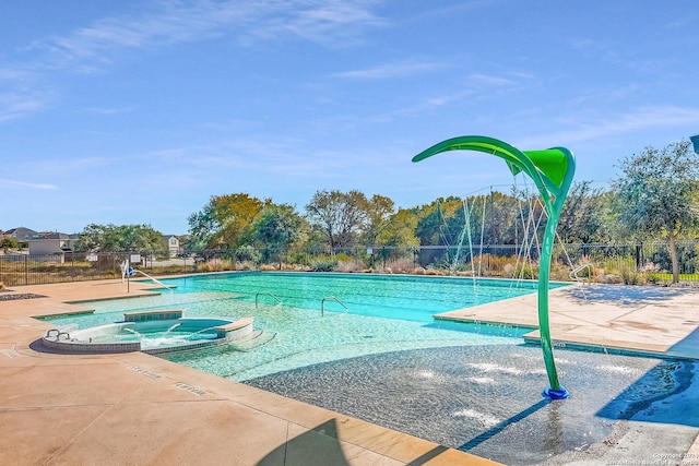 view of pool with pool water feature and a community hot tub