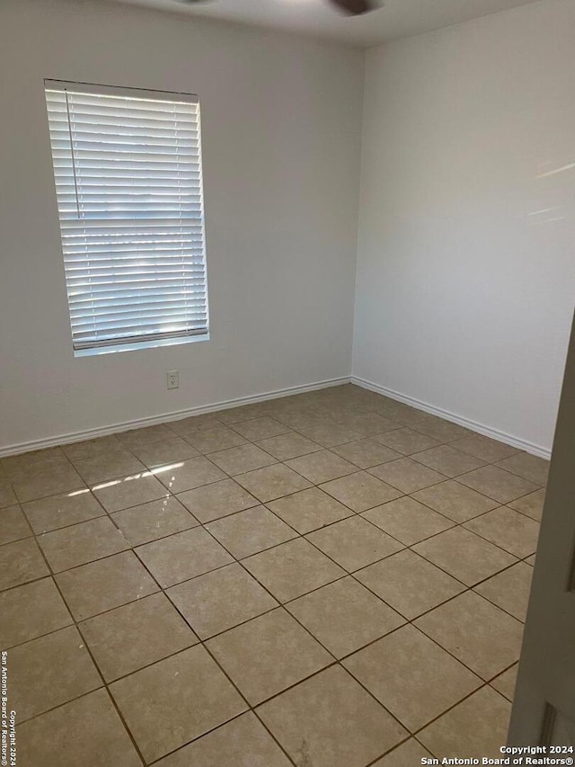 unfurnished room with light tile patterned floors