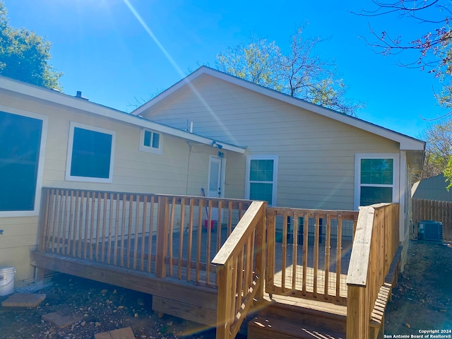 wooden terrace featuring central air condition unit