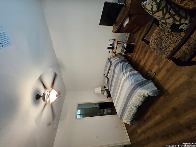 bedroom featuring hardwood / wood-style floors