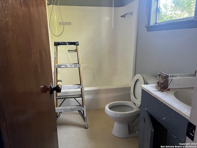 full bathroom featuring vanity, shower / bath combination, and toilet