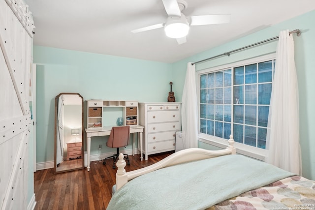 bedroom with ceiling fan and dark wood-type flooring