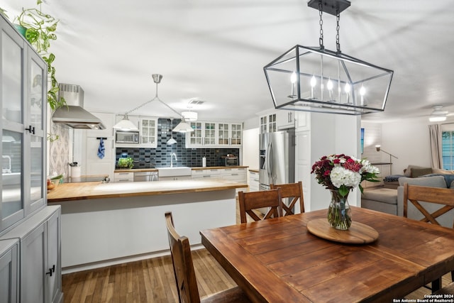 dining room featuring dark hardwood / wood-style flooring and sink