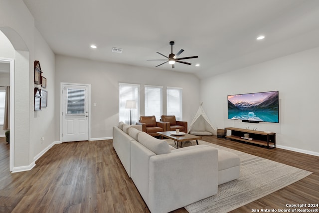 living room with ceiling fan and wood-type flooring