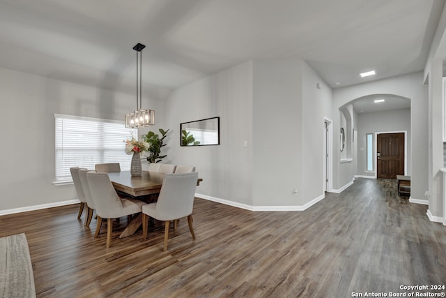 dining space with hardwood / wood-style flooring