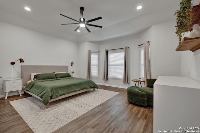 bedroom featuring ceiling fan and dark hardwood / wood-style flooring