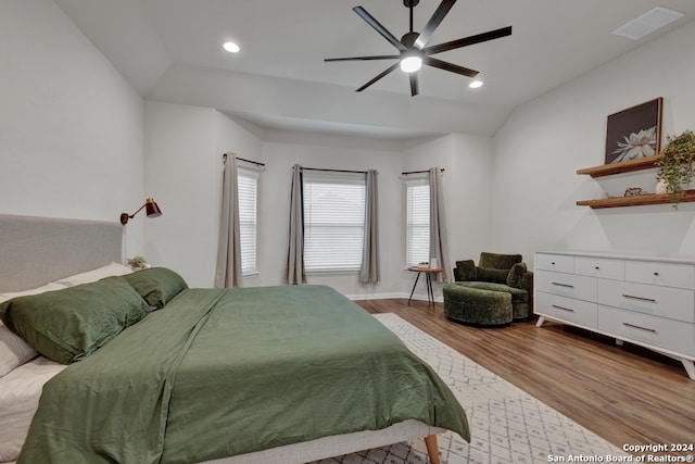 bedroom featuring light wood-type flooring, ceiling fan, and lofted ceiling