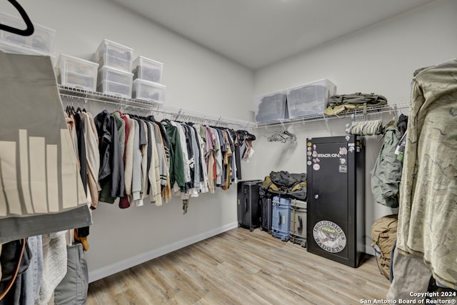 spacious closet featuring light hardwood / wood-style floors