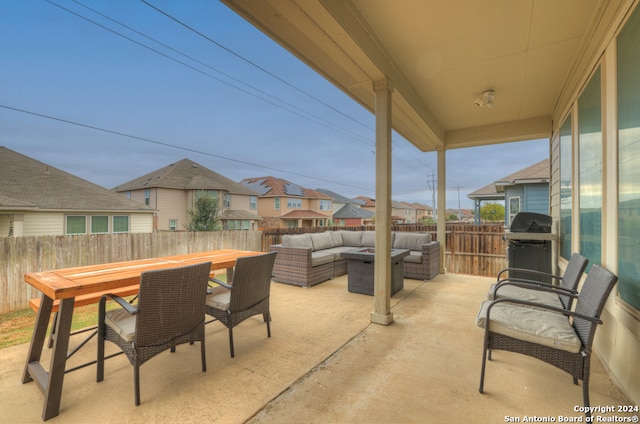 view of patio featuring a grill and an outdoor hangout area