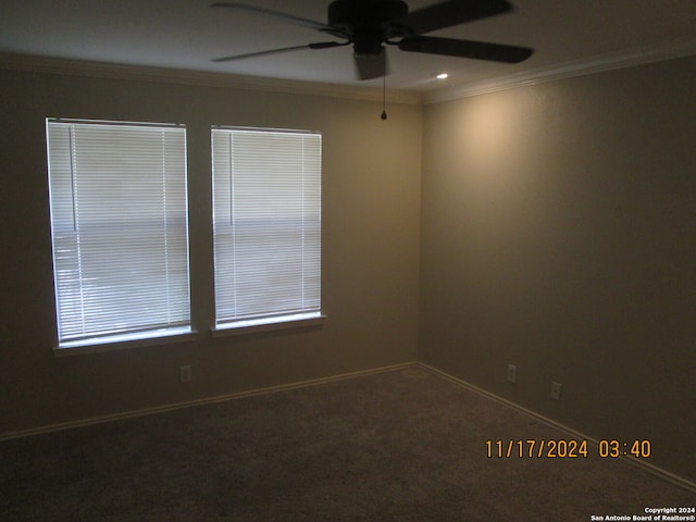 carpeted empty room featuring crown molding and ceiling fan