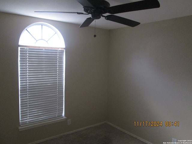 carpeted empty room with ceiling fan