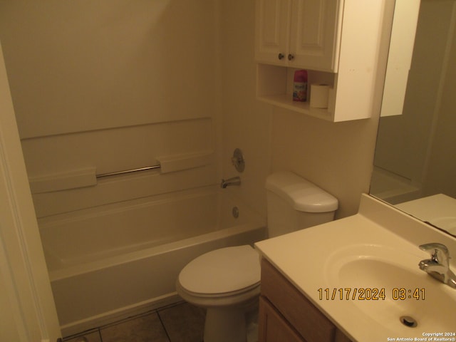 full bathroom featuring toilet, vanity, tile patterned floors, and tub / shower combination