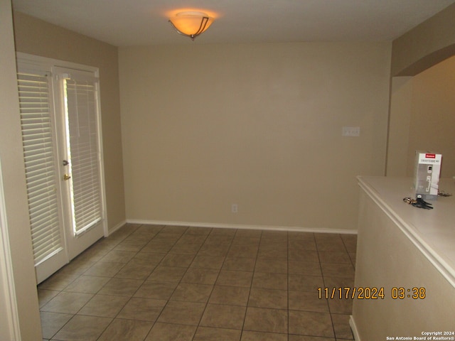 interior space with dark tile patterned floors