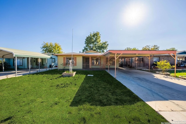 view of front facade with a front yard and a carport