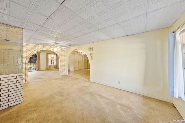 spare room featuring carpet floors and ceiling fan