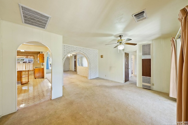 carpeted empty room with ceiling fan