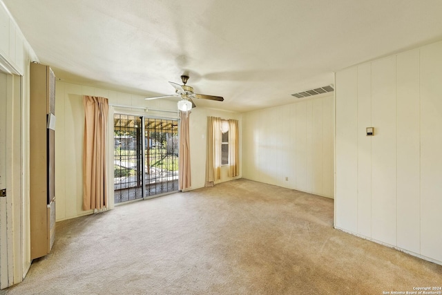 carpeted empty room with ceiling fan