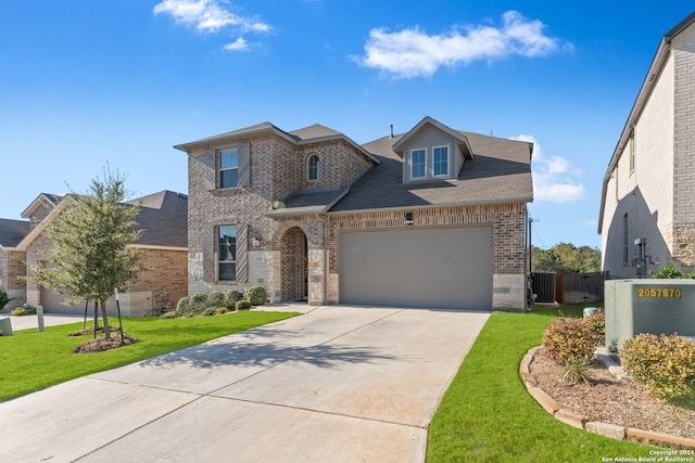 view of front of property featuring central AC, a front lawn, and a garage