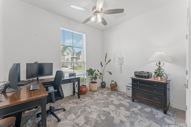 office space with ceiling fan and light hardwood / wood-style floors