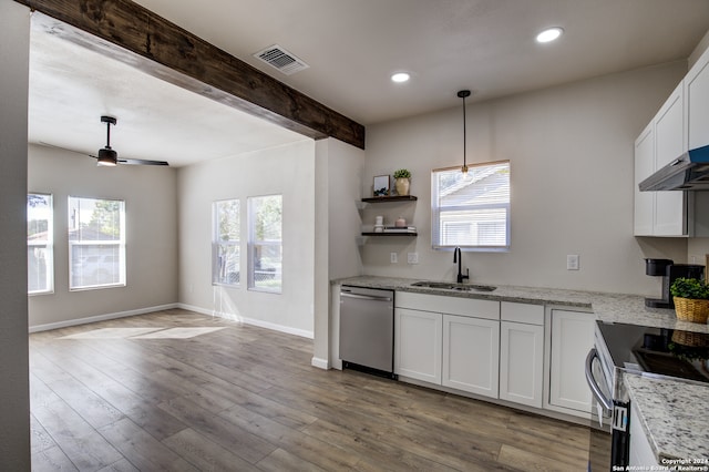 kitchen featuring white cabinets, appliances with stainless steel finishes, a healthy amount of sunlight, and sink