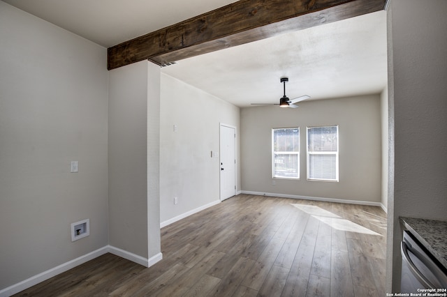 unfurnished room featuring hardwood / wood-style flooring, ceiling fan, and beamed ceiling