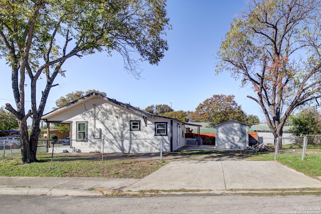 view of front of house with a storage unit