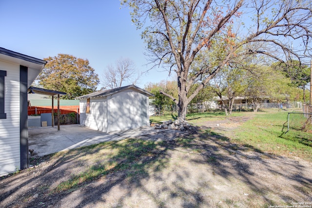 view of yard with a patio area and a shed