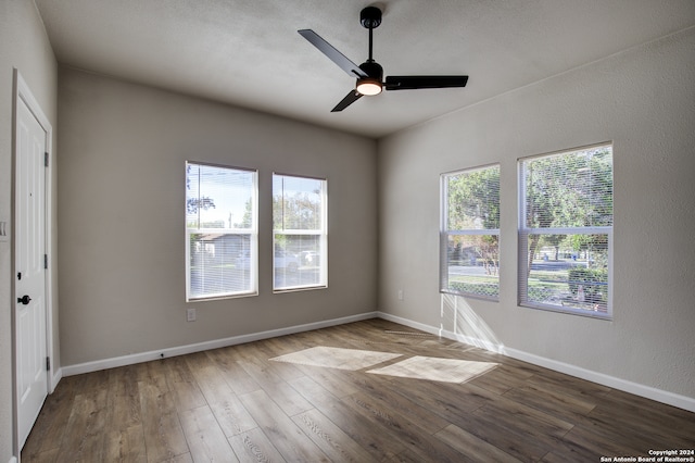 empty room featuring hardwood / wood-style floors and ceiling fan