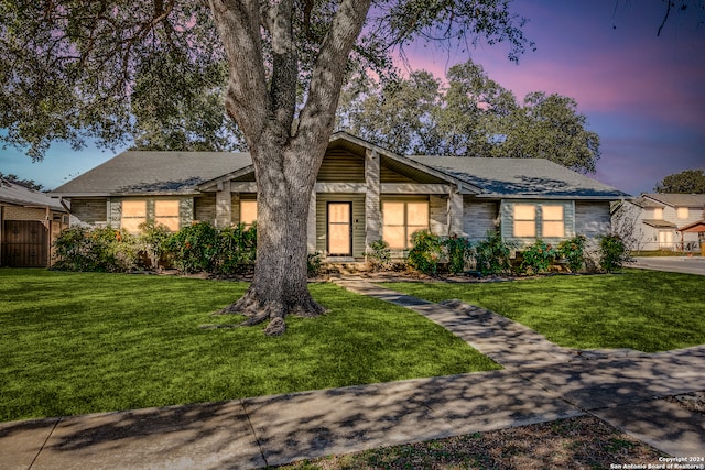 view of front of property with a lawn