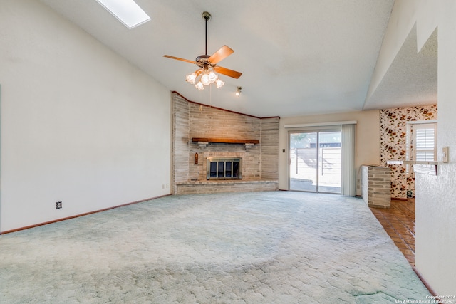 unfurnished living room featuring carpet flooring, a brick fireplace, a textured ceiling, ceiling fan, and high vaulted ceiling