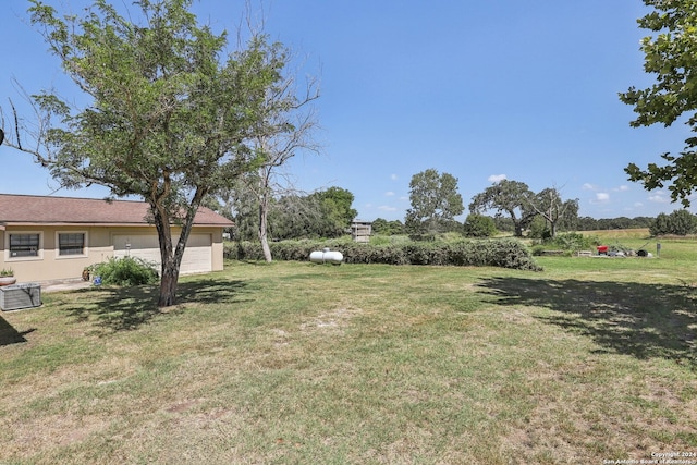 view of yard with a garage