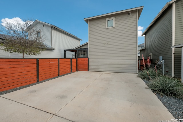 rear view of property featuring a patio