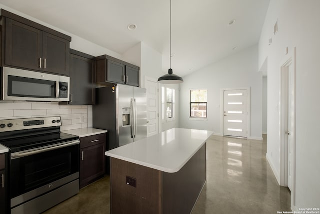 kitchen featuring a center island, stainless steel appliances, tasteful backsplash, pendant lighting, and dark brown cabinets