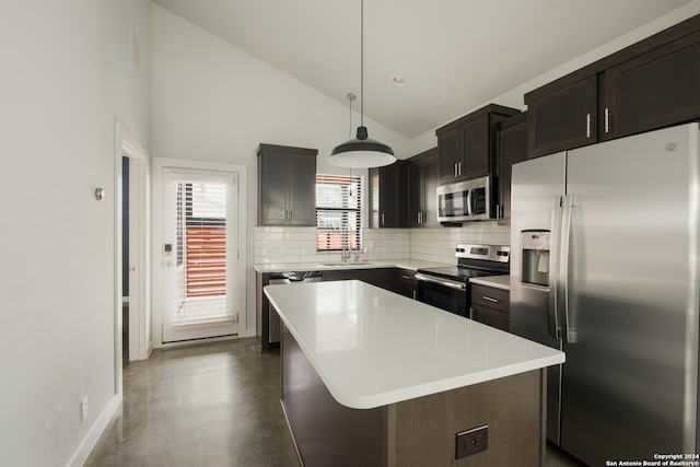 kitchen featuring a center island, tasteful backsplash, decorative light fixtures, dark brown cabinets, and appliances with stainless steel finishes