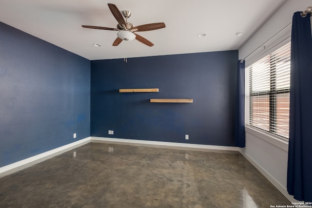 unfurnished room featuring ceiling fan and a healthy amount of sunlight