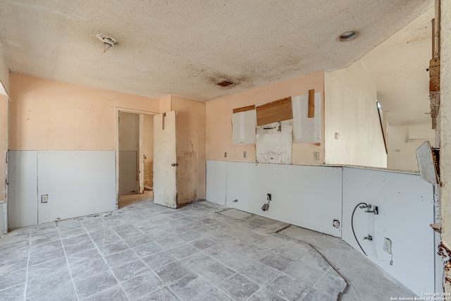 interior space featuring a textured ceiling