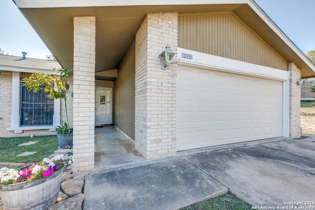 doorway to property featuring a garage