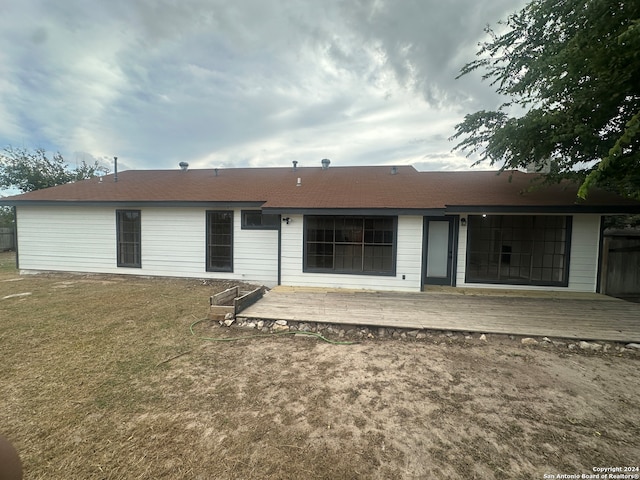 rear view of house with a lawn