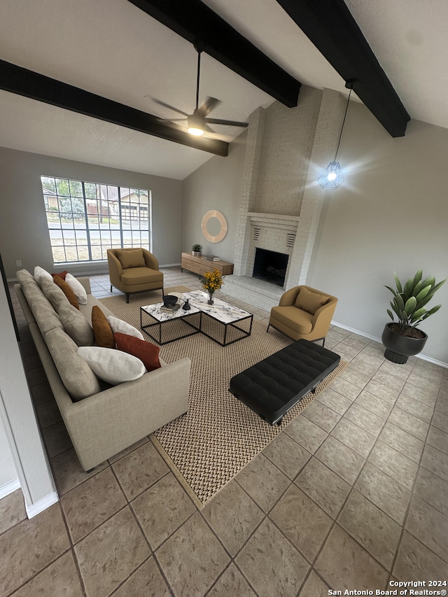 living room with ceiling fan, a fireplace, light tile patterned flooring, and lofted ceiling with beams