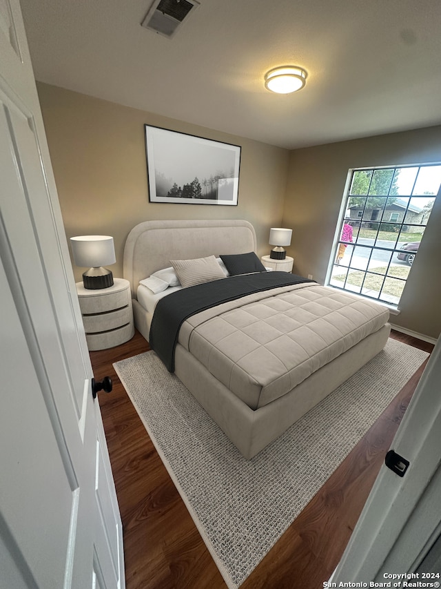 bedroom featuring dark hardwood / wood-style flooring