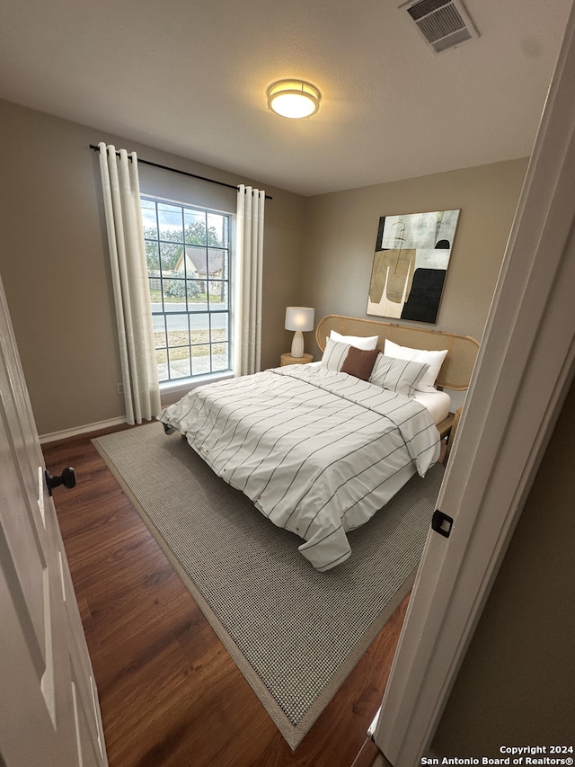 bedroom featuring dark hardwood / wood-style floors